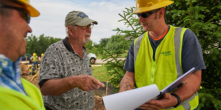 consumers energy employee working in community